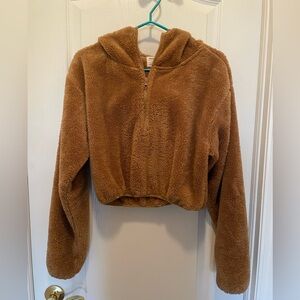 Plush Faux-Sherpa teddy bear cropped hoodie.